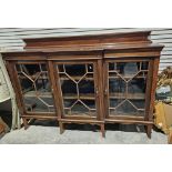 Late 19th/early 20th century mahogany display cabinet/sideboard with three glazed doors containing