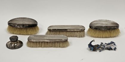 Silver-backed dressing table brush set comprising two pairs of brushes, monogrammed and with