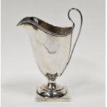 Edwardian silver helmet-shaped cream jug on square pedestal base, Chester 1902 by Stokes & Ireland