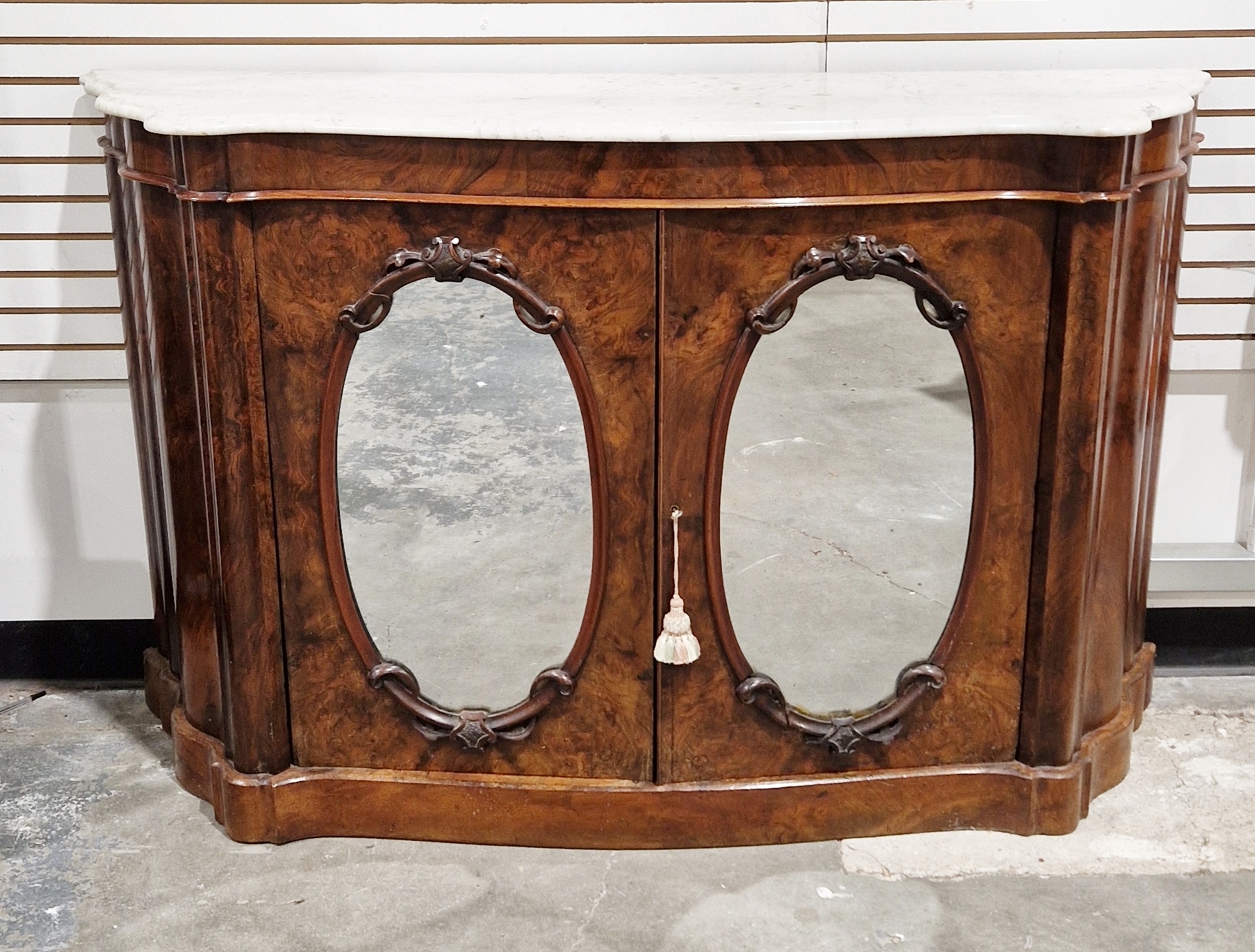 19th century burr walnut marble-topped chiffoniere, the two mirrored cupboard doors opening to