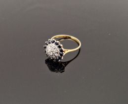 18ct gold, modern sapphire and diamond cluster ring set small diamond surrounded by sapphires