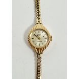 Lady’s Rotary 9ct gold wristwatch, the circular face with engraved case, on integral herringbone-