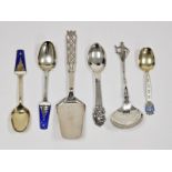 A collection of various Scandinavian silver-coloured spoons, including a David Anderson enamelled
