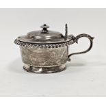 A William IV circular silver mustard and cover, the hinged cover with knop finial, shell and foliate