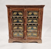 20th century stained hardwood Indian cupboard, the doors with embossed brass metal panels