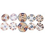 Group of Japanese imari porcelain dishes and plates, comprising seven scalloped plates and two