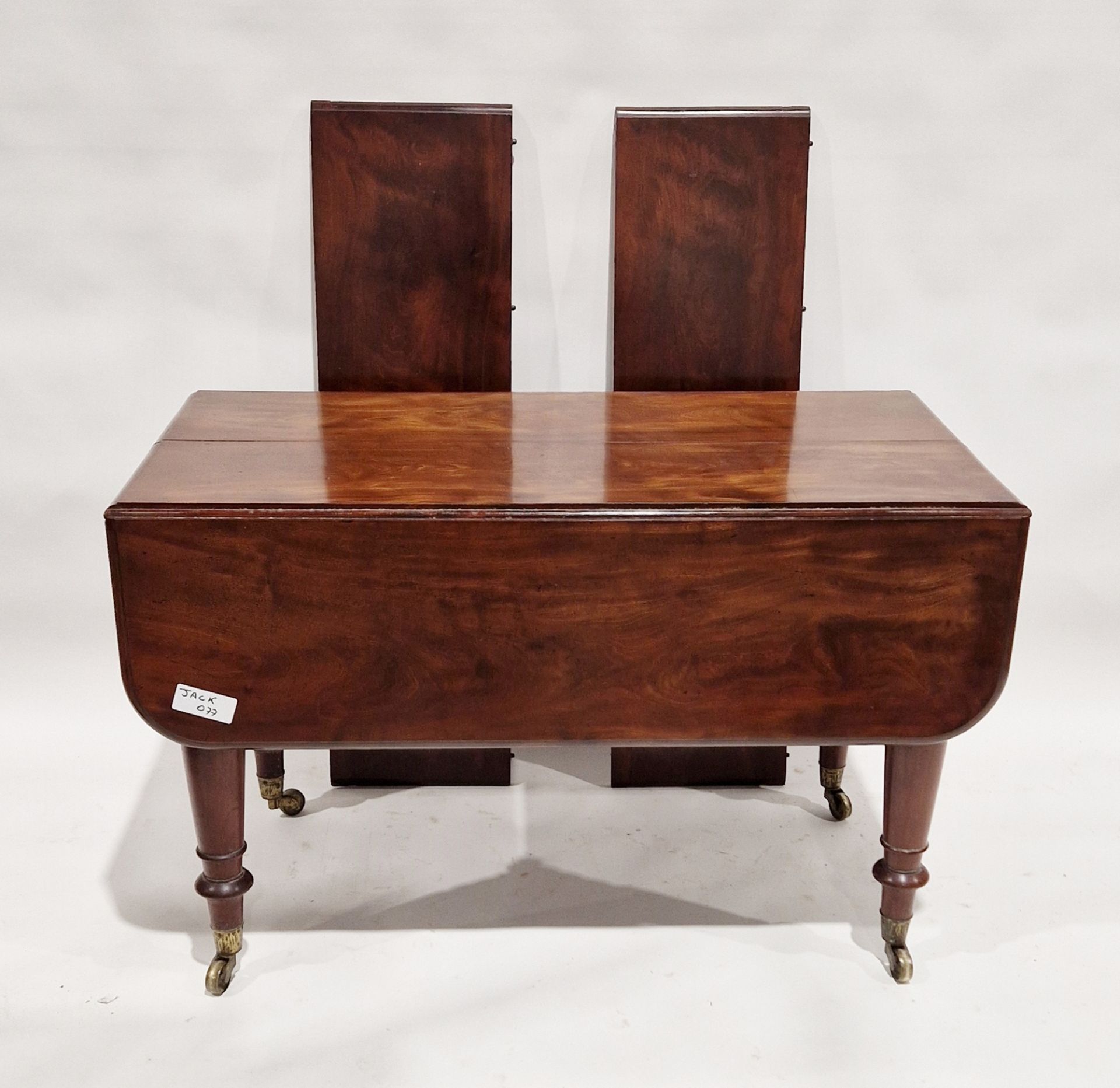 Unusual Victorian mahogany extending drop-leaf dining table with two additional leaves, on turned