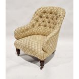 Late 19th/early 20th century buttonback armchair upholstered in yellow floral fabric, on castors,