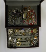 Quantity of costume jewellery to include silver chains, necklaces, brooches and silver-coloured