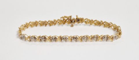 10K gold and diamond bracelet, the small diamonds in illusion setting with foliate X links, 5.5g
