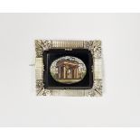 White metal mounted micro-mosaic brooch depicting ancient square-topped arch