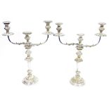 Pair of silver plated candelabra, each three light with removable foliate scroll drip trays, waisted