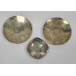 A pair of South African silver-coloured metal circular footed dishes, both inset with a 1969 one