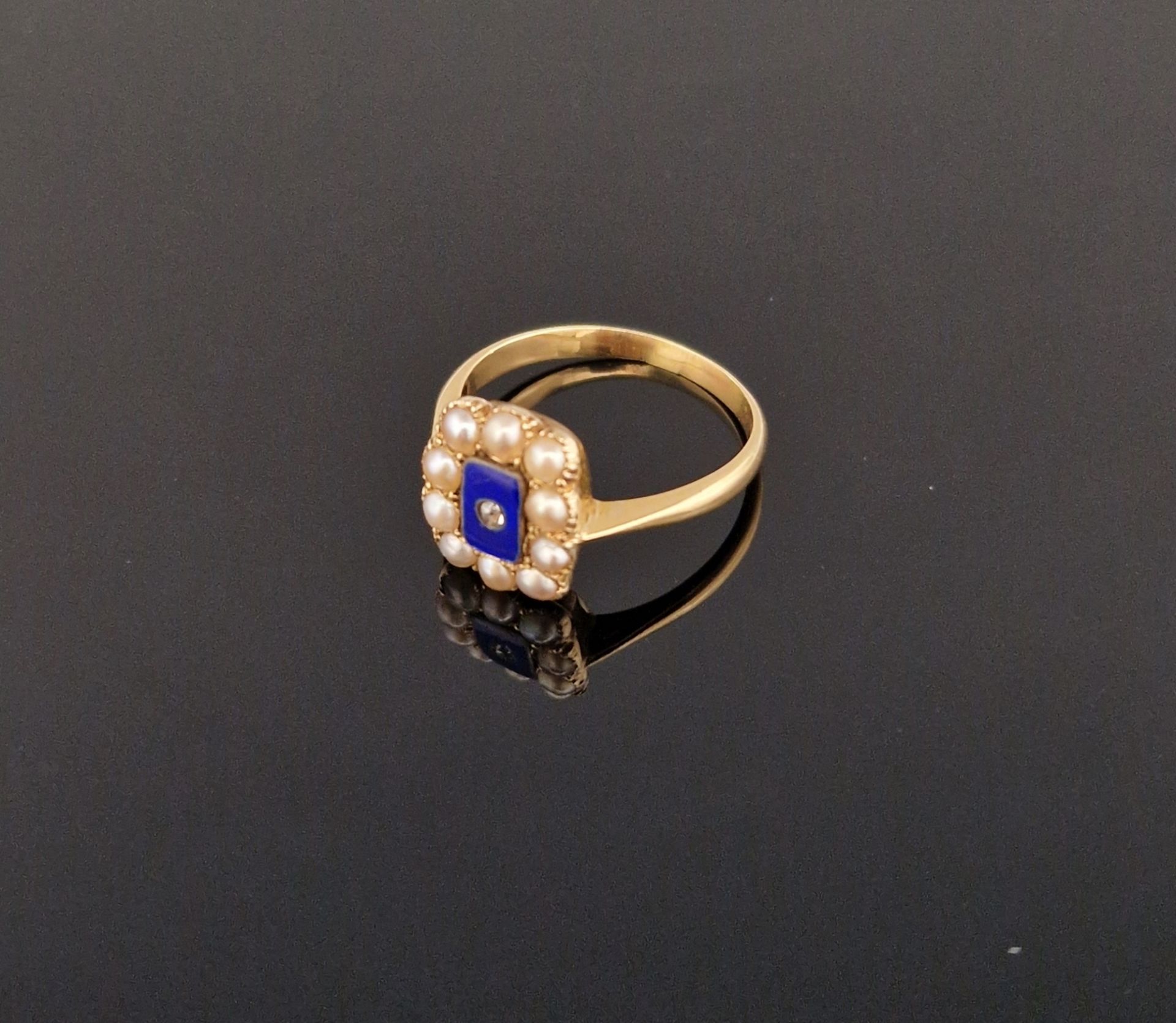 Victorian gold-coloured metal, enamel, pearl and diamond ring, the rectangular enamel centre set