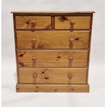 20th century pine chest of two short over three long drawers, each with turned handles, 93cm high