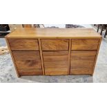 Modern stained hardwood sideboard comprising three short drawers and three cupboards, 85cm high x