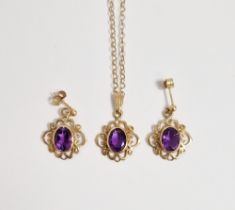 9ct gold and amethyst pendant on chain, the oval stone with scroll surround and matching pair