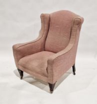 Wing back armchair in Georgian style, on wooden legs with castors, 100cm high