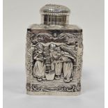 Dutch silver-coloured metal tea caddy, square-section, the domed cover with picture of boy beside