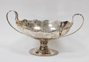 George V silver twin-handled boat-shaped fruit bowl with wavy rim, on oval pedestal base,