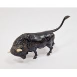 Patinated bronze and bone-mounted miniature model of a bull, 20th century, naturalistically cast