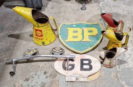 Collection of vintage motoring items to include a metal BP sign painted green and yellow, a Shell