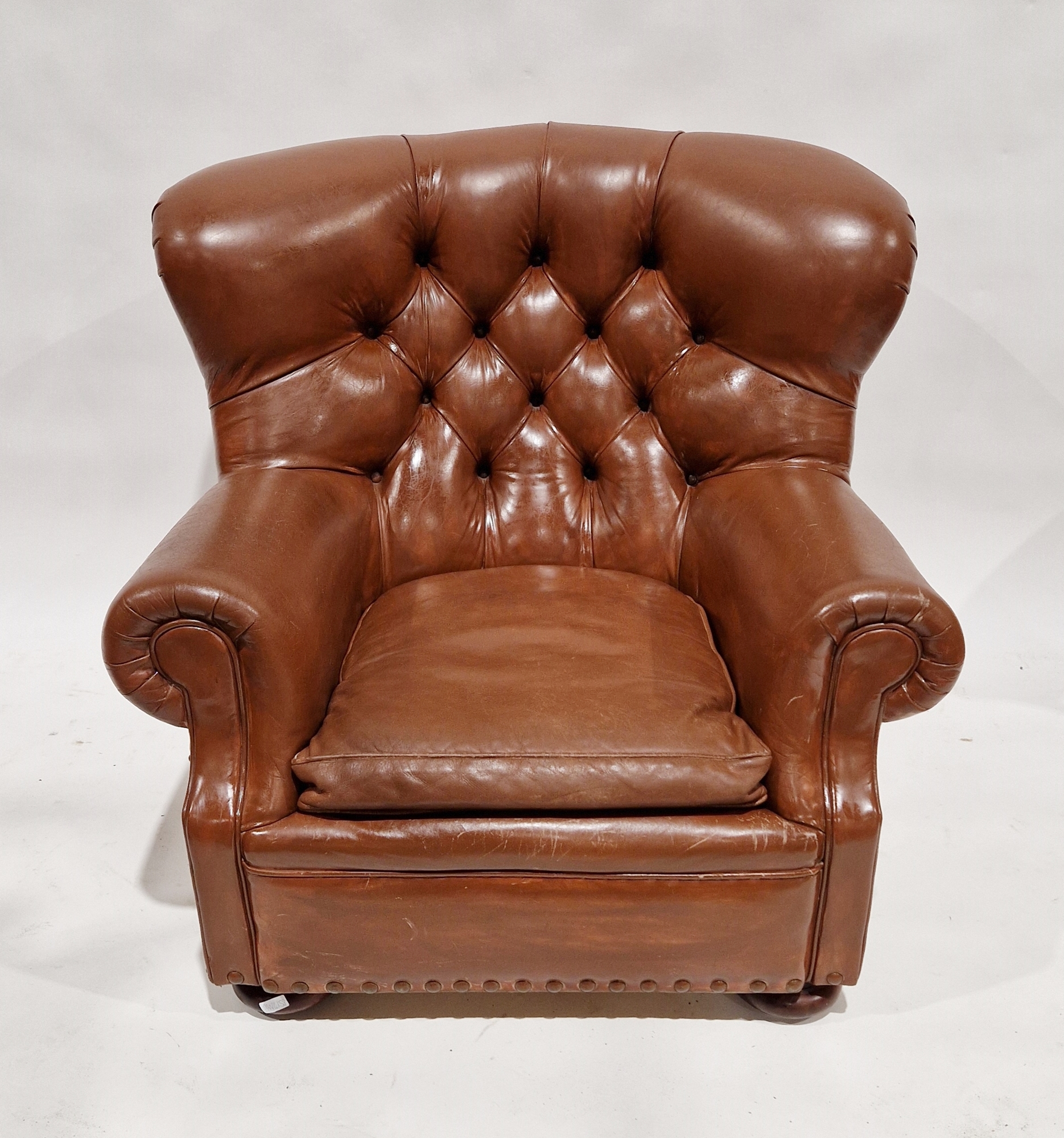 Ralph Lauren leather button back writer's armchair, on bun feet, 96cm high