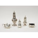 Selection of silver condiments including pepper shakers, lidded mustard and open salt and a silver