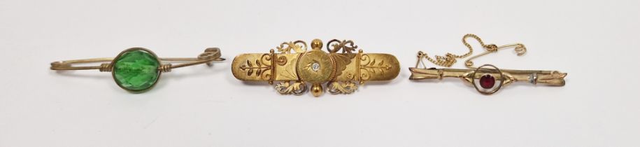 LOT WITHDRAWN 9ct gold bar brooch, pierced with garnet-coloured stone to the centre, a Victorian