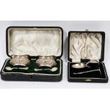 Pair of Edwardian silver salts, Birmingham 1904, of shaped oval design with floral and scroll