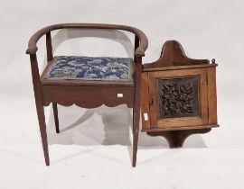 A late 19th/early20th century small oak corner cupboard with carved oak panel, together with an