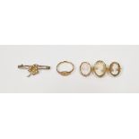 9ct gold small signet ring, a triple-carved shell cameo bar brooch in gold-coloured mount and a