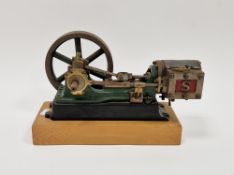 Model, stationary single cylinder steam engine by Stuart, on a wooden base, 20cm long