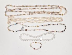 Two long strings of pink, cream and other coloured cultured pearls, a string of coloured cultured