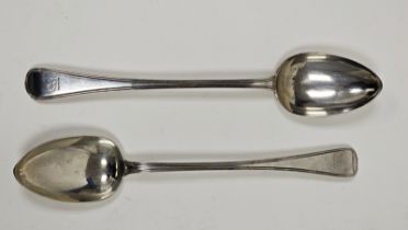 A pair of William IV silver serving spoons, engraved with family crest, approximately 31cm long,