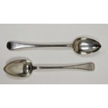 A pair of William IV silver serving spoons, engraved with family crest, approximately 31cm long,