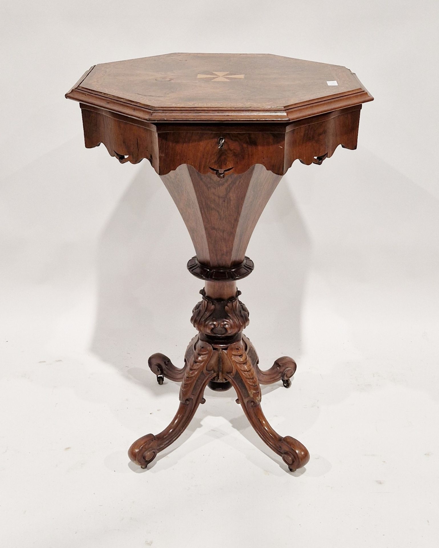 Victorian walnut sewing table of octagonal form, inlaid marquetry to the lid, opening to reveal