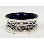 George V silver miniature dish ring of typical waisted form and pierced with foliate scrolls and two