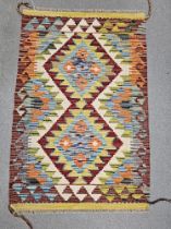 Chobi cream ground kilim,  with two central lozenges on geometric zig-zag field with single