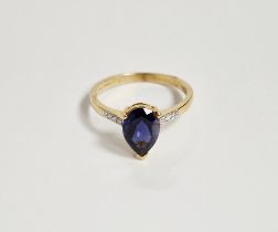 10K gold, blue stone and diamond ring set pear-shaped claw set stone, possibly tanzanite, with small
