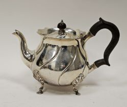 Edwardian silver bachelor's teapot by Carrington & Co, London 1907, of circular form on four leaf