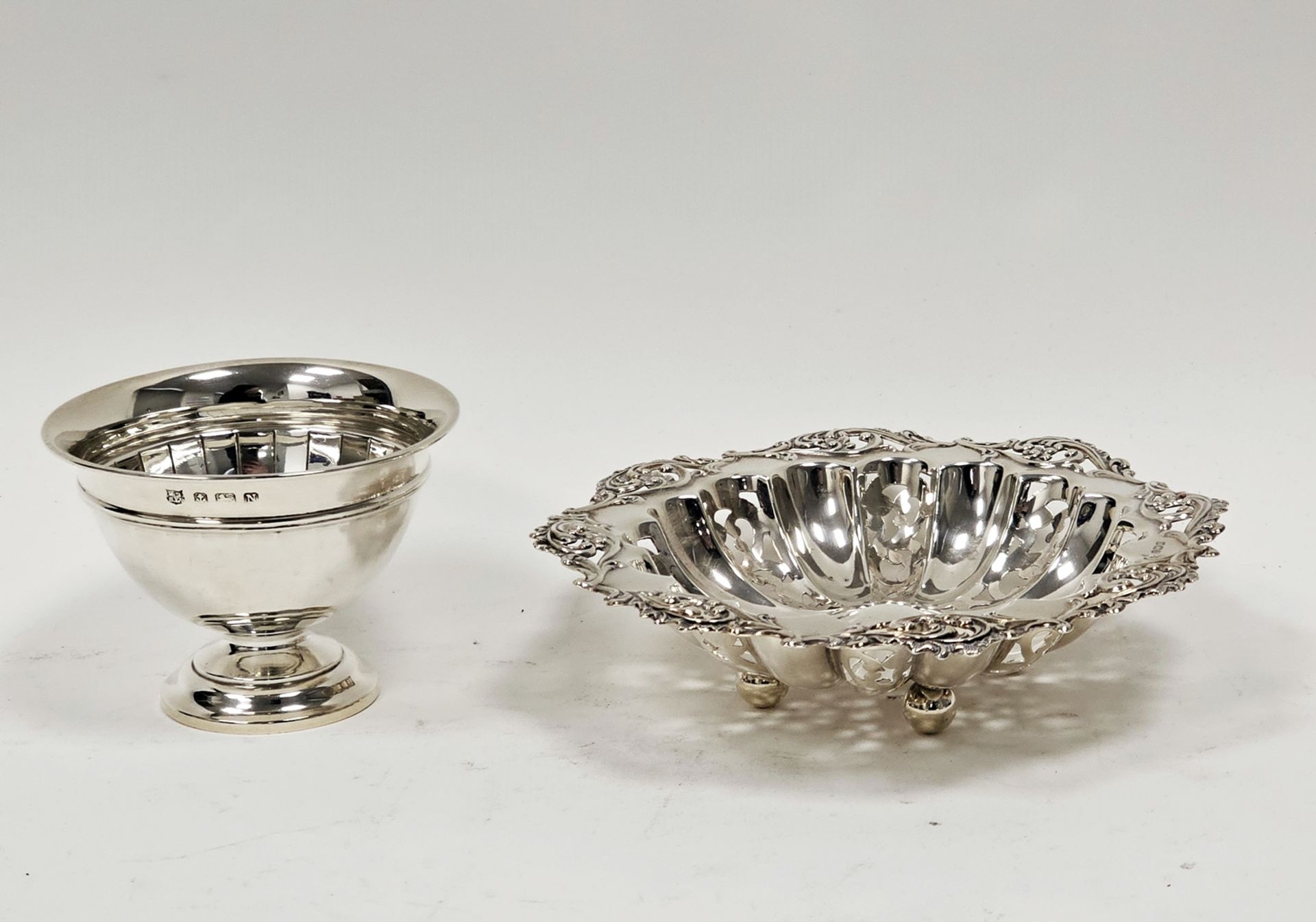 Silver bon-bon dish, circular and lobed having everted and pierced foliate scroll border,