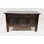 Jacobean-style oak chest of plain hinged top and carved and panelled front, 68cm high x 121cm wide x