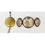 Japanese satsuma earthenware buckle in three sections, circular and shaped oval, painted with