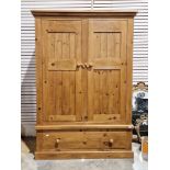 Pine two-door wardrobe over a single long drawer, 185cm high x 130cm wide x 60cm deep