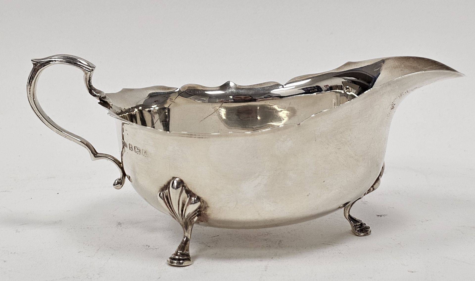 Georgian-style silver sauceboat of typical oval form with everted ogee cut-card borders and raised - Image 2 of 3