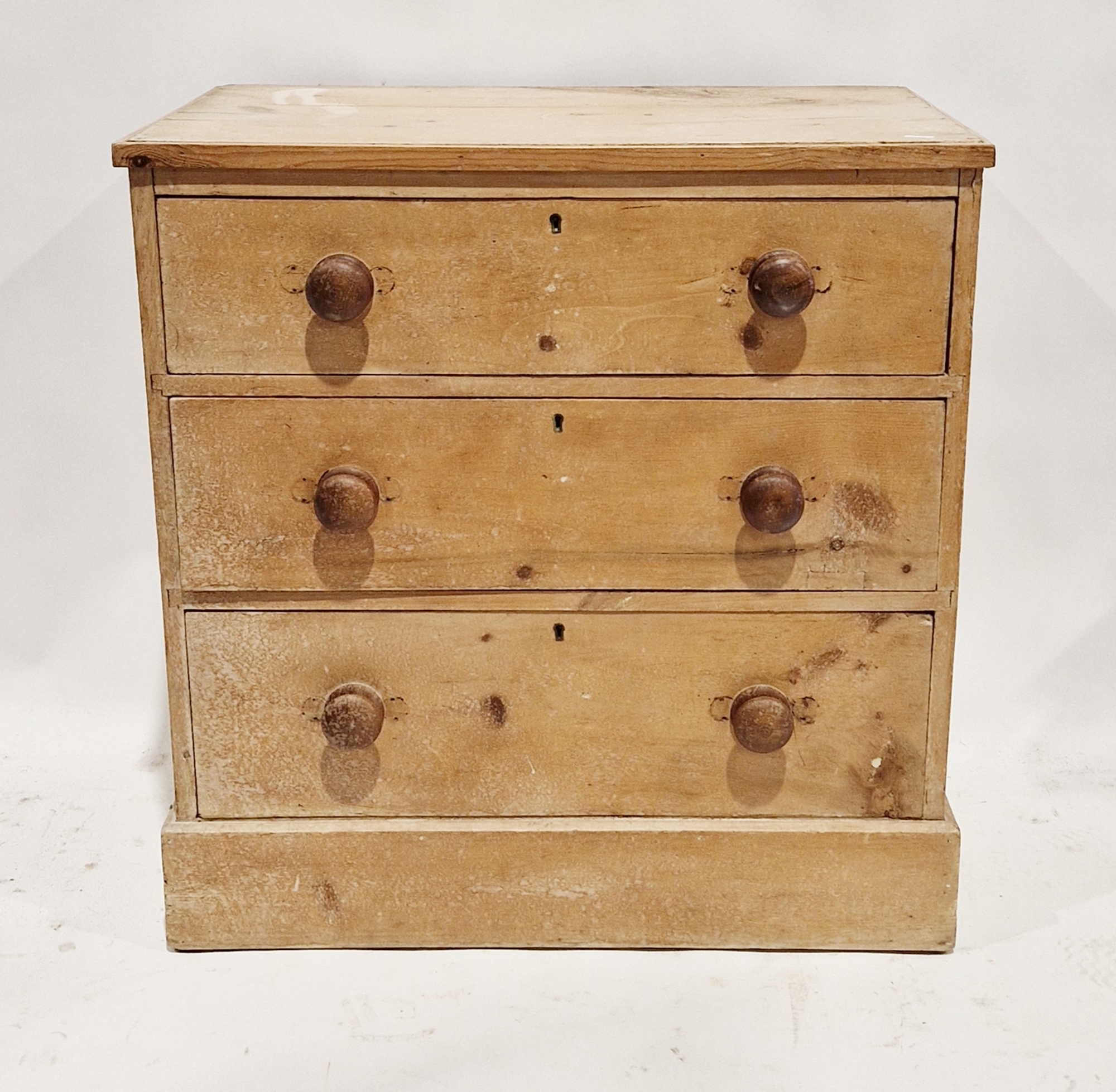 Victorian pine chest of three long drawers, each with turned wooden handles, 78cm high x 74cm wide x