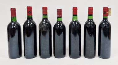 Three unlabelled bottles of Jean-Pierre Moueix red wine (JPM on capsule) and four other unlabelled