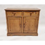 Victorian pine sideboard having two short drawers over a two-door cupboard, 86cm high x 104cm wide x