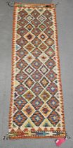 Chobi kilim cream ground runner, with three rows of ten and two rows of nine lozenges, flanked by